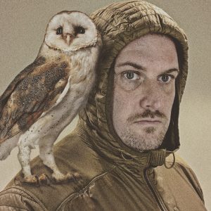 Myself in and adventure hoodie and my owl Abby on my shoulder